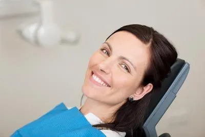 woman smiling in the dental chair at Pettey Dental of Bartlett
