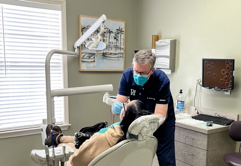 Bartlett, TN dentist Dr. David Pettey providing dental care with one of his patients at Pettey Dental of Bartlett